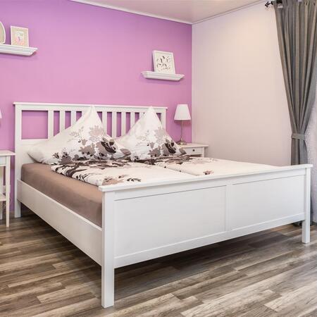 Ferienwohnung - Schlafzimmer mit einem Doppelbett